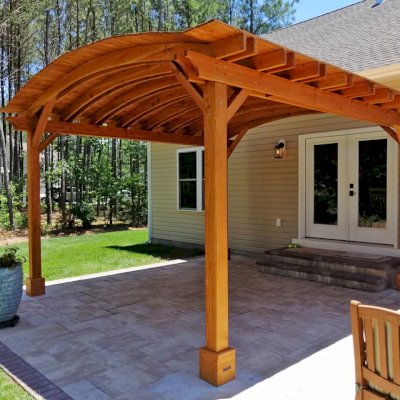 Backyard Pavilion Kits (Options: 16' L x 15' Arc W, Douglas-fir, No Post Electrical Wiring Trim, 4-Post Anchor Kit for Concrete, No Ceiling Fan Base, No Privacy Panels, No Curtain Rods, 9 ft Post Height, Transparent Premium Sealant). Photo Courtesy of S. Fly of Millsboro, Delaware.